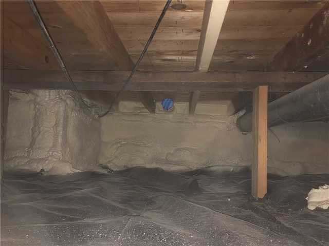 Crawl space walls sealed with spray foam and a new vapor barrier